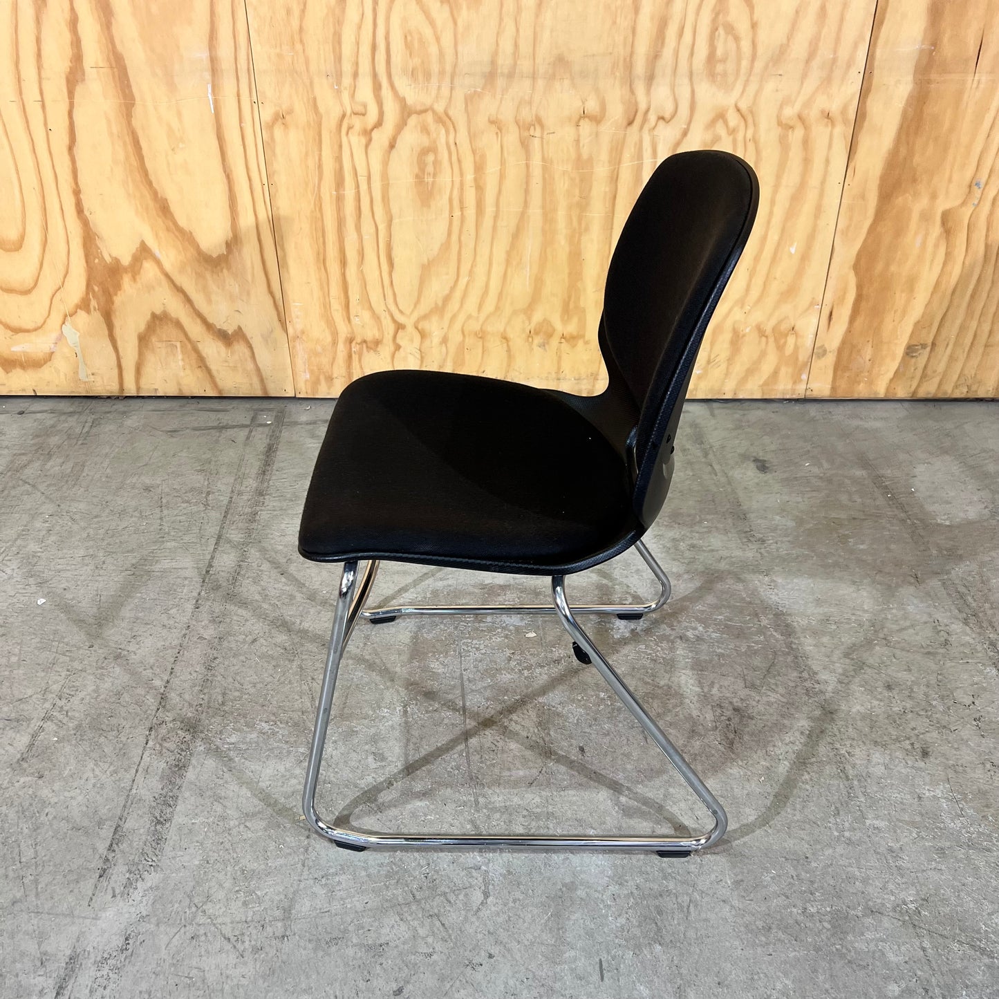 Black fabric and moulded plastic visitors chair