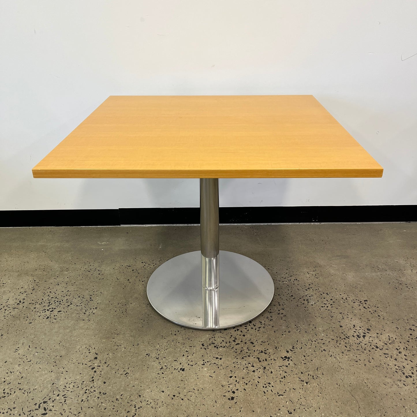 Square wooden table with silver base