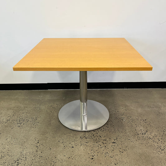 Square wooden table with silver base