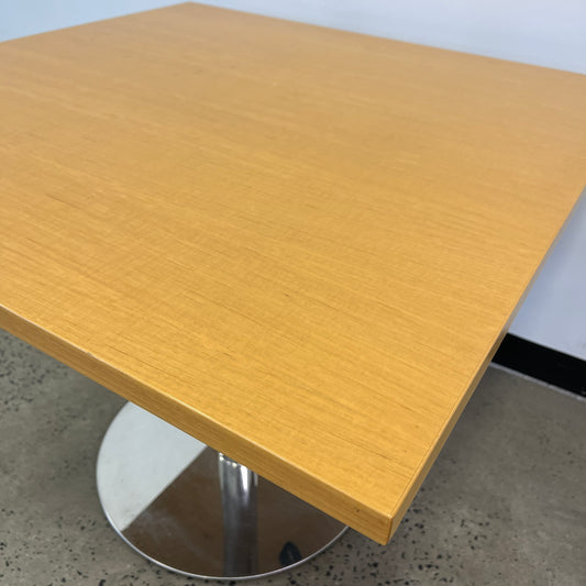 Square wooden table with silver base