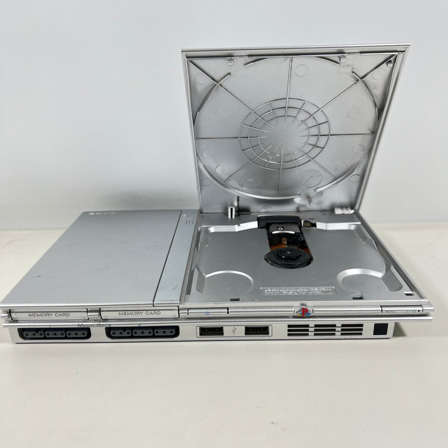 Sony PlayStation 2 Silver Slim with a Silver DualShock Controller 2 Only