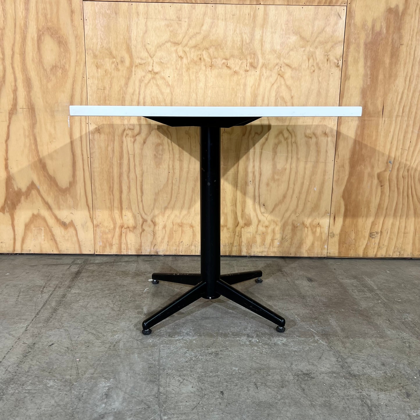 Square White Table on Black Metal Base