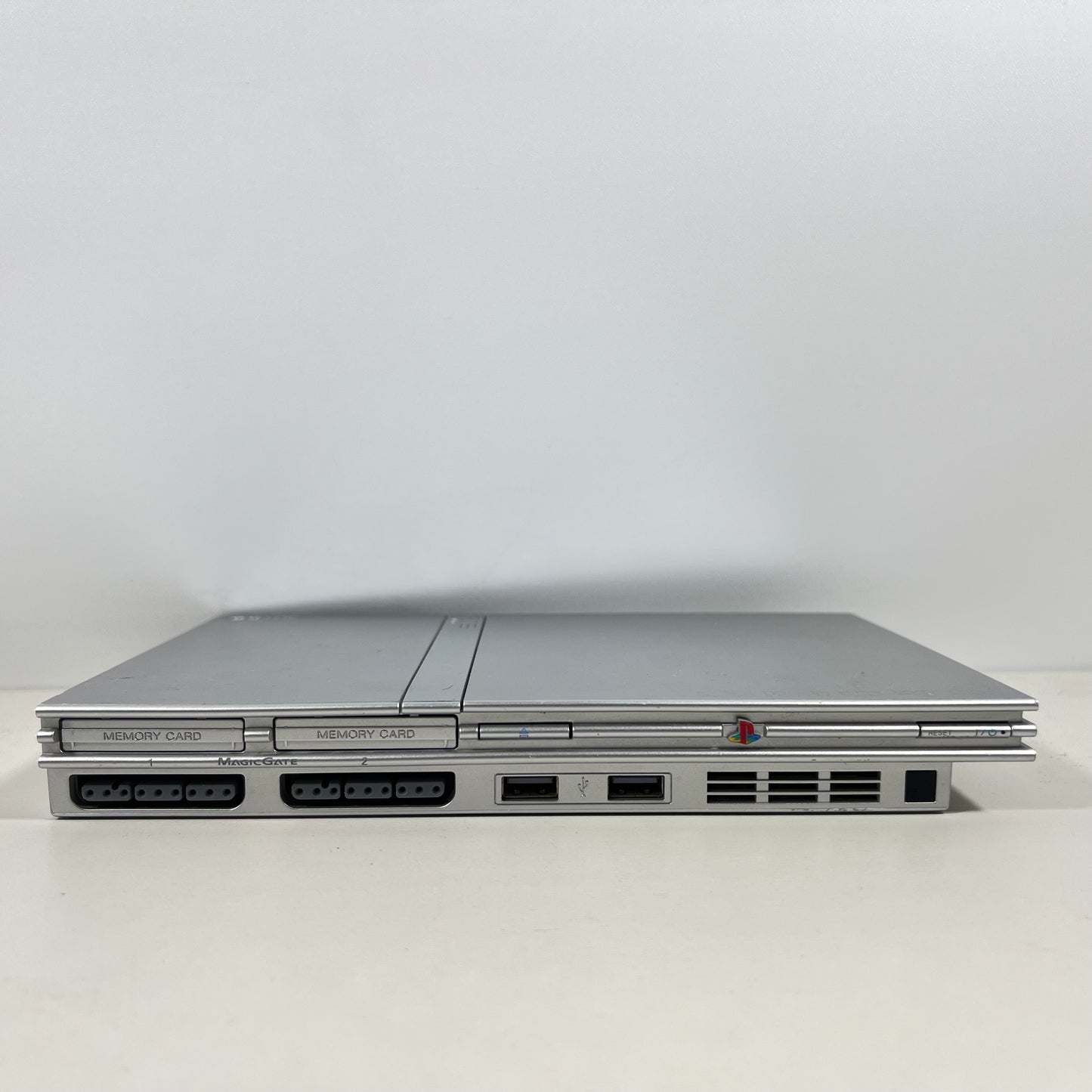 Sony PlayStation 2 Silver Slim with a Silver DualShock Controller 2 Only