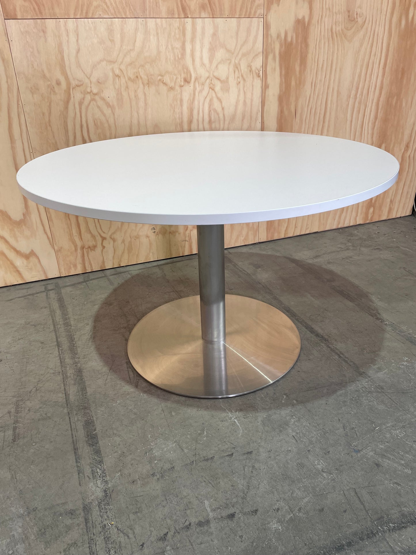 White round meeting table on chrome base