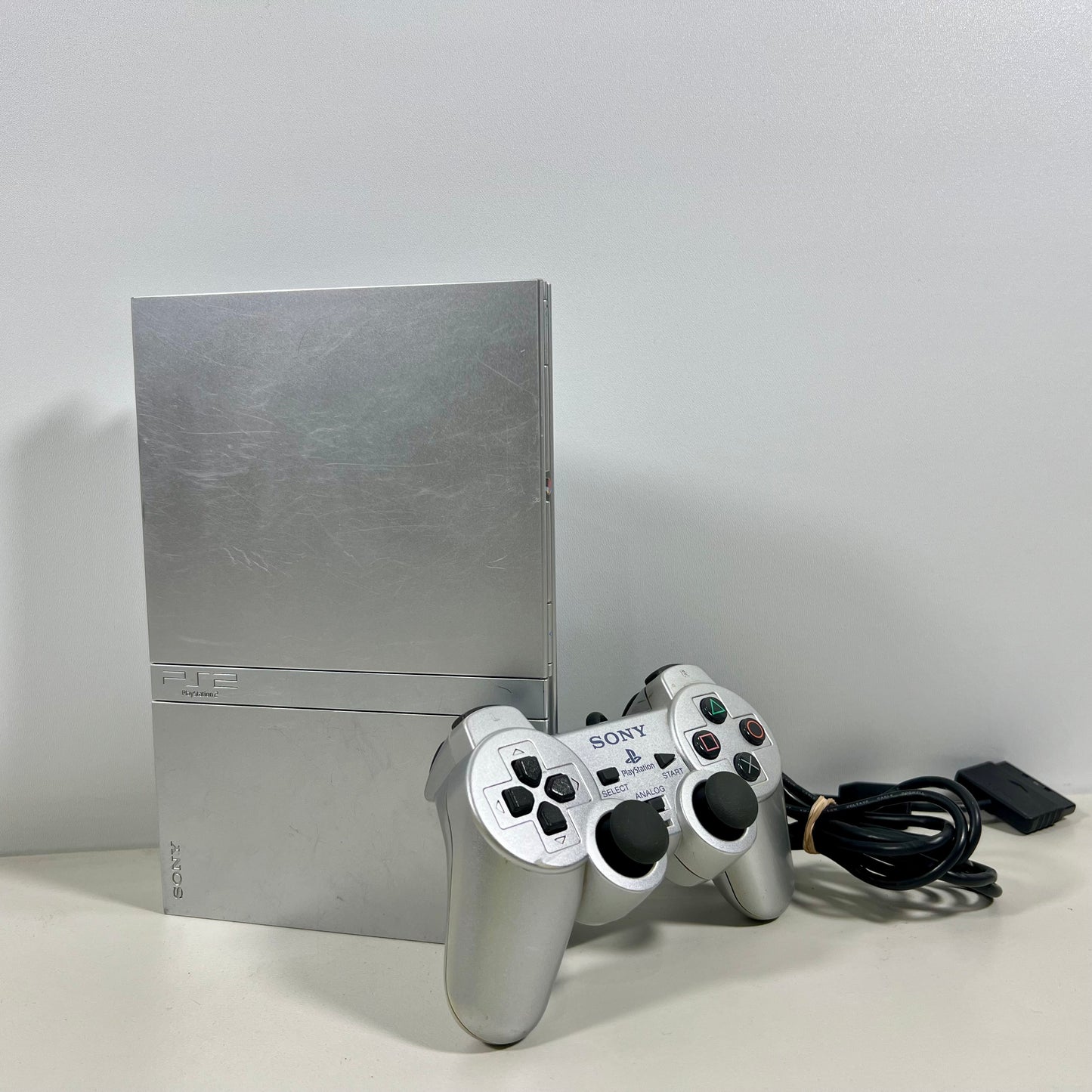 Sony PlayStation 2 Silver Slim with a Silver DualShock Controller 2 Only