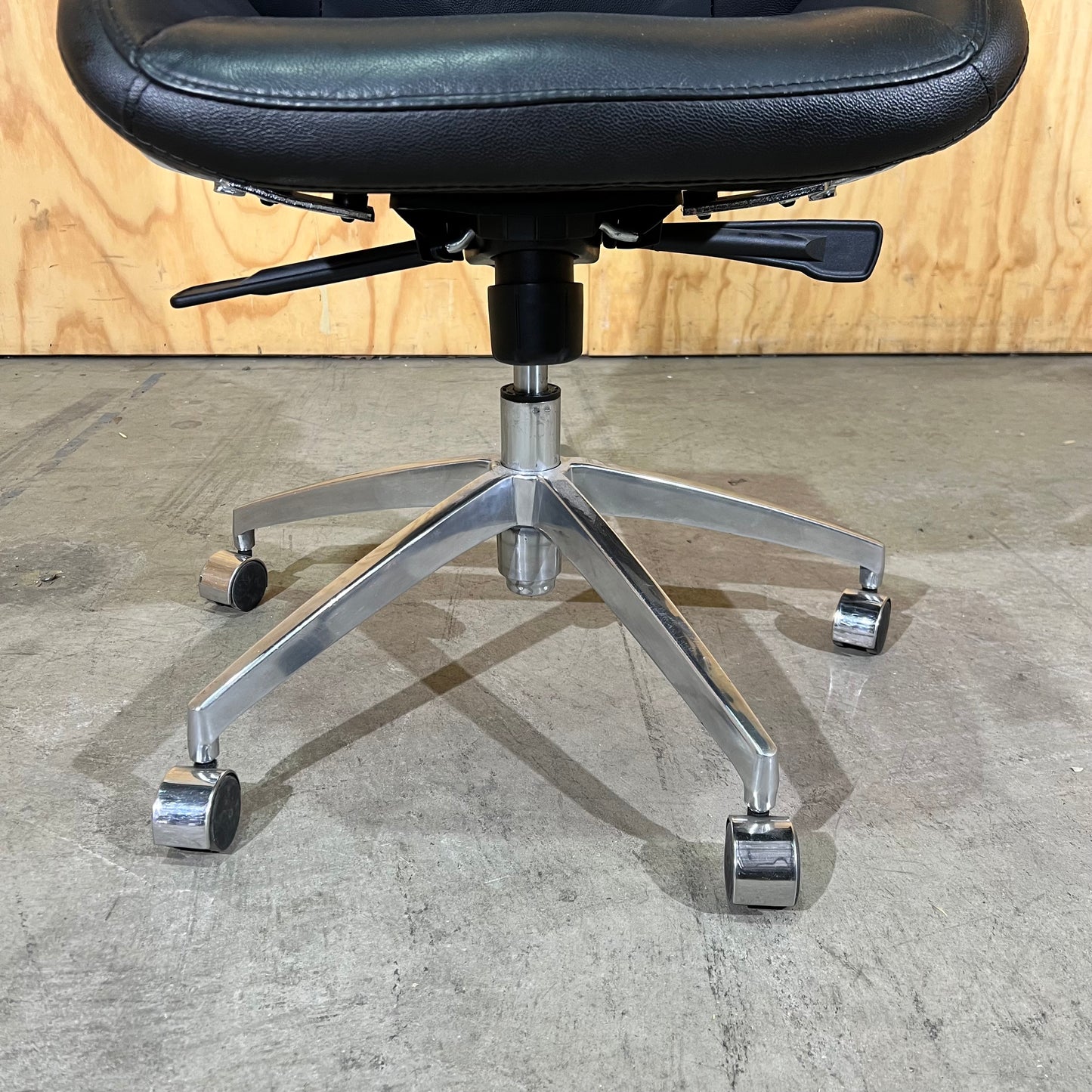 Black leather executive chair with arms