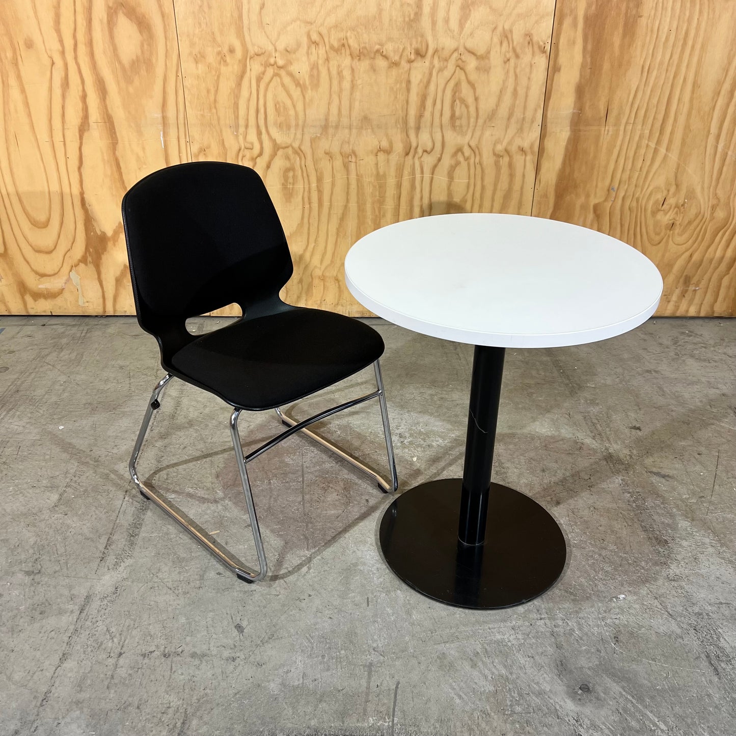 Black fabric and moulded plastic visitors chair