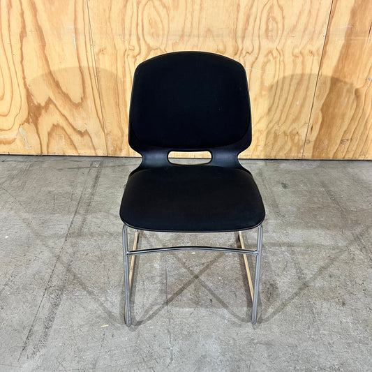 Black fabric and moulded plastic visitors chair