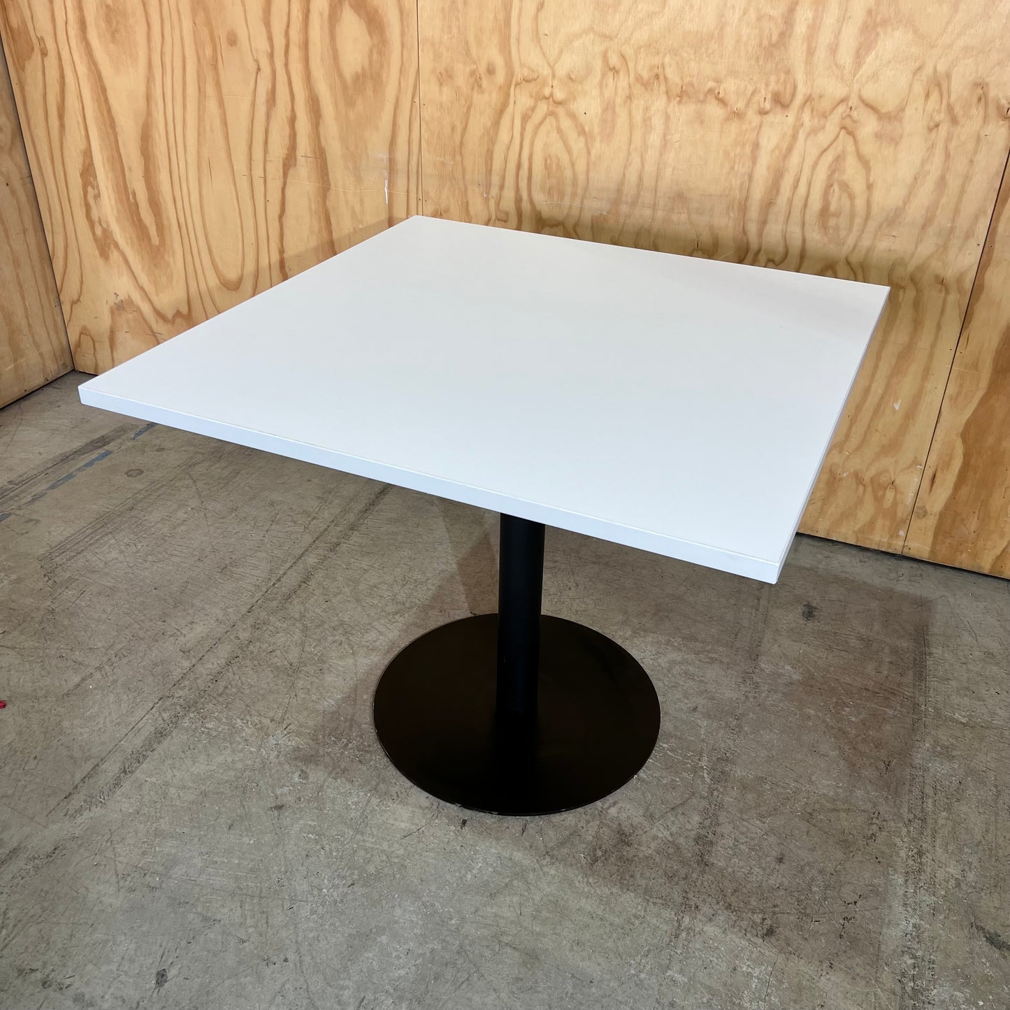 White Square Table on Black Metal Base