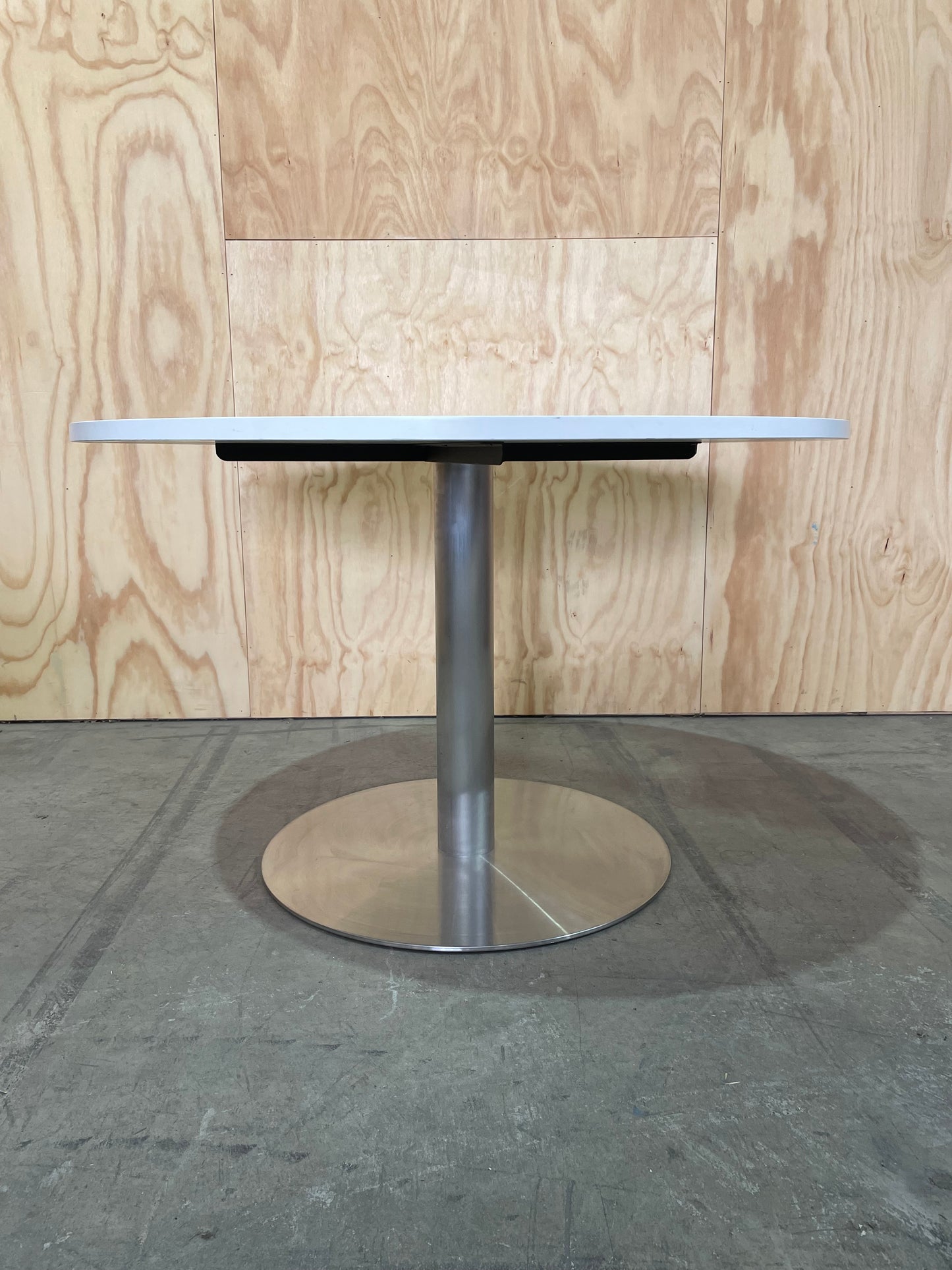 White round meeting table on chrome base