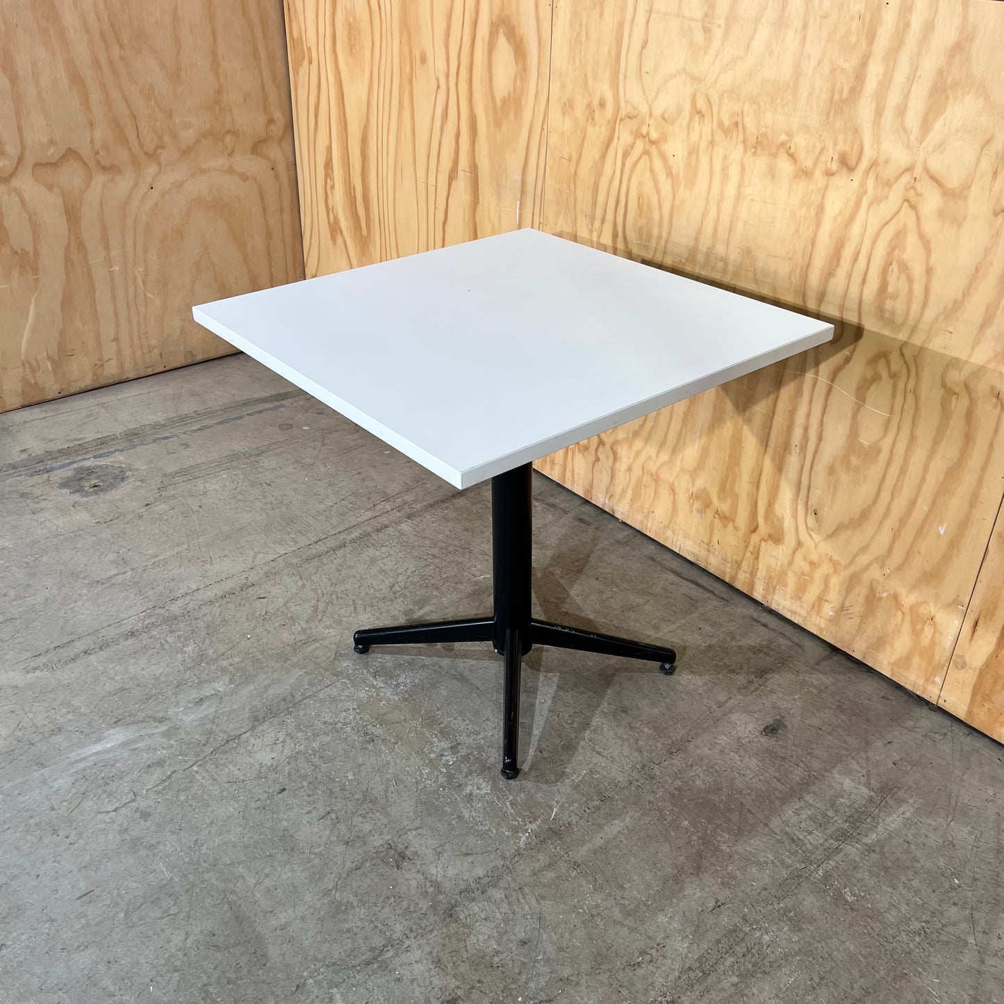Square White Table on Black Metal Base