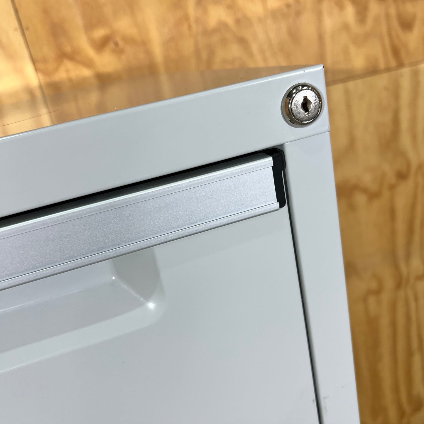 Grey Metal Four Drawer Filing Cabinet