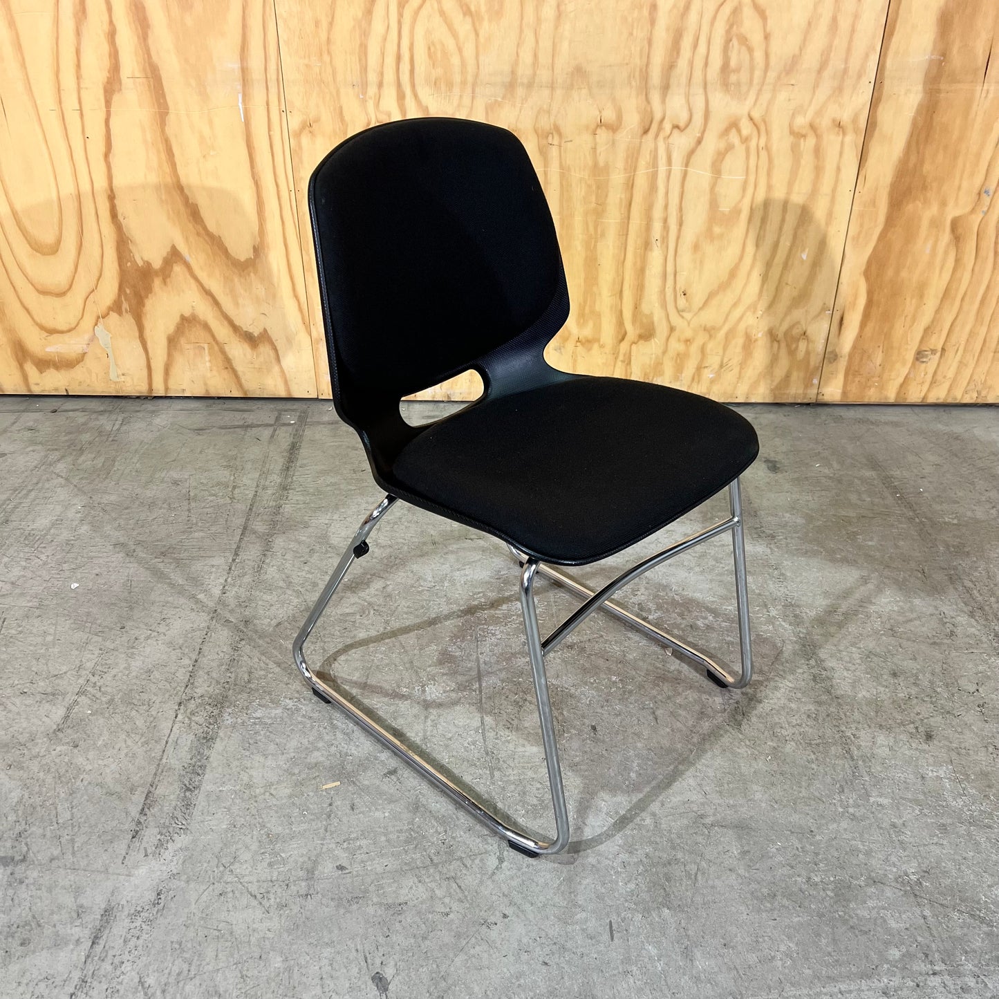 Black fabric and moulded plastic visitors chair