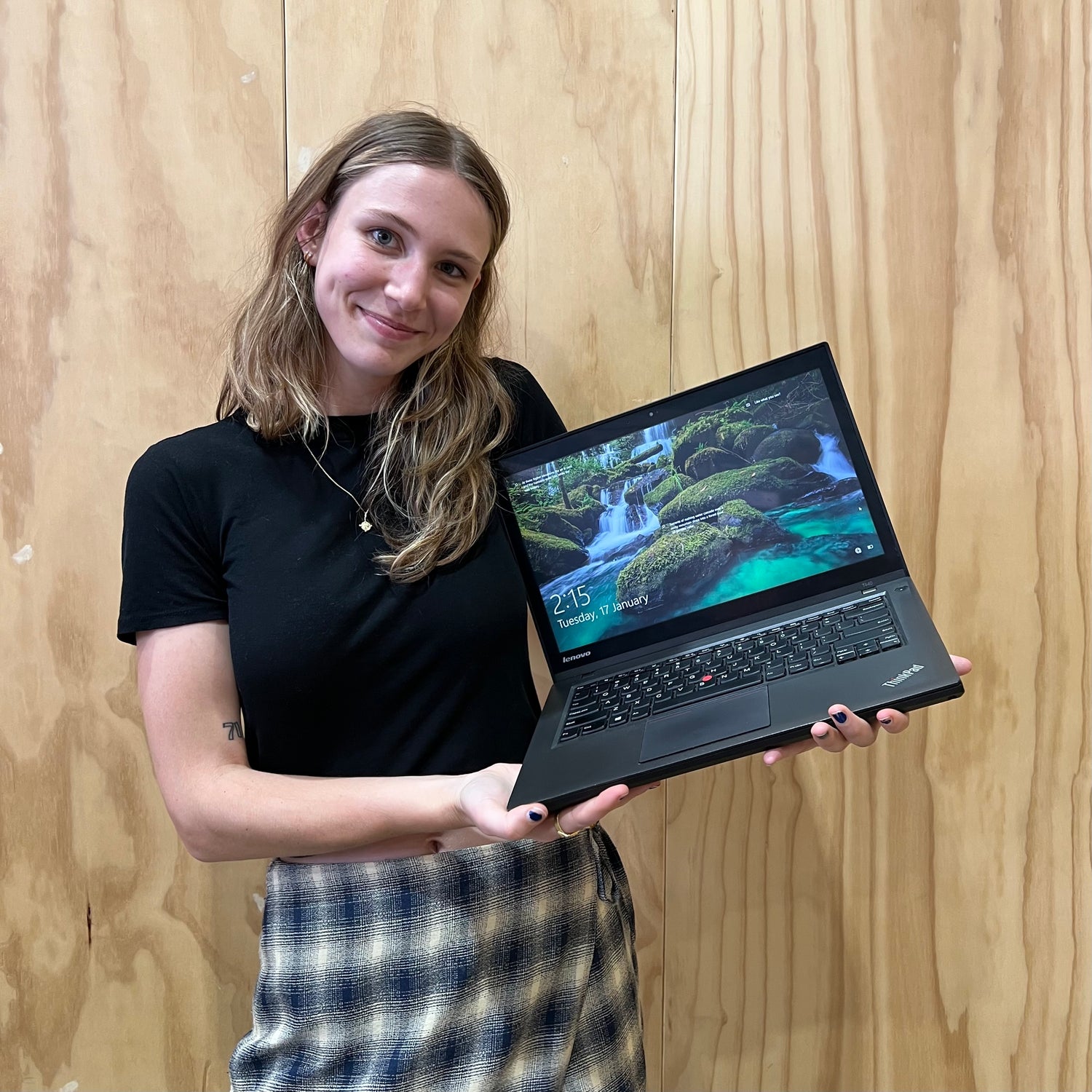 Eshe Lane holding secondhand reclaimed IT equipment, procured from Green Collect's office clear out service