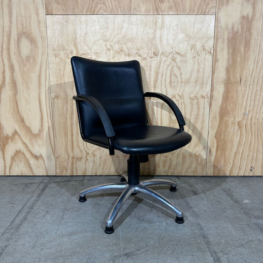 Black faux leather swivel chair on chrome base by Pago