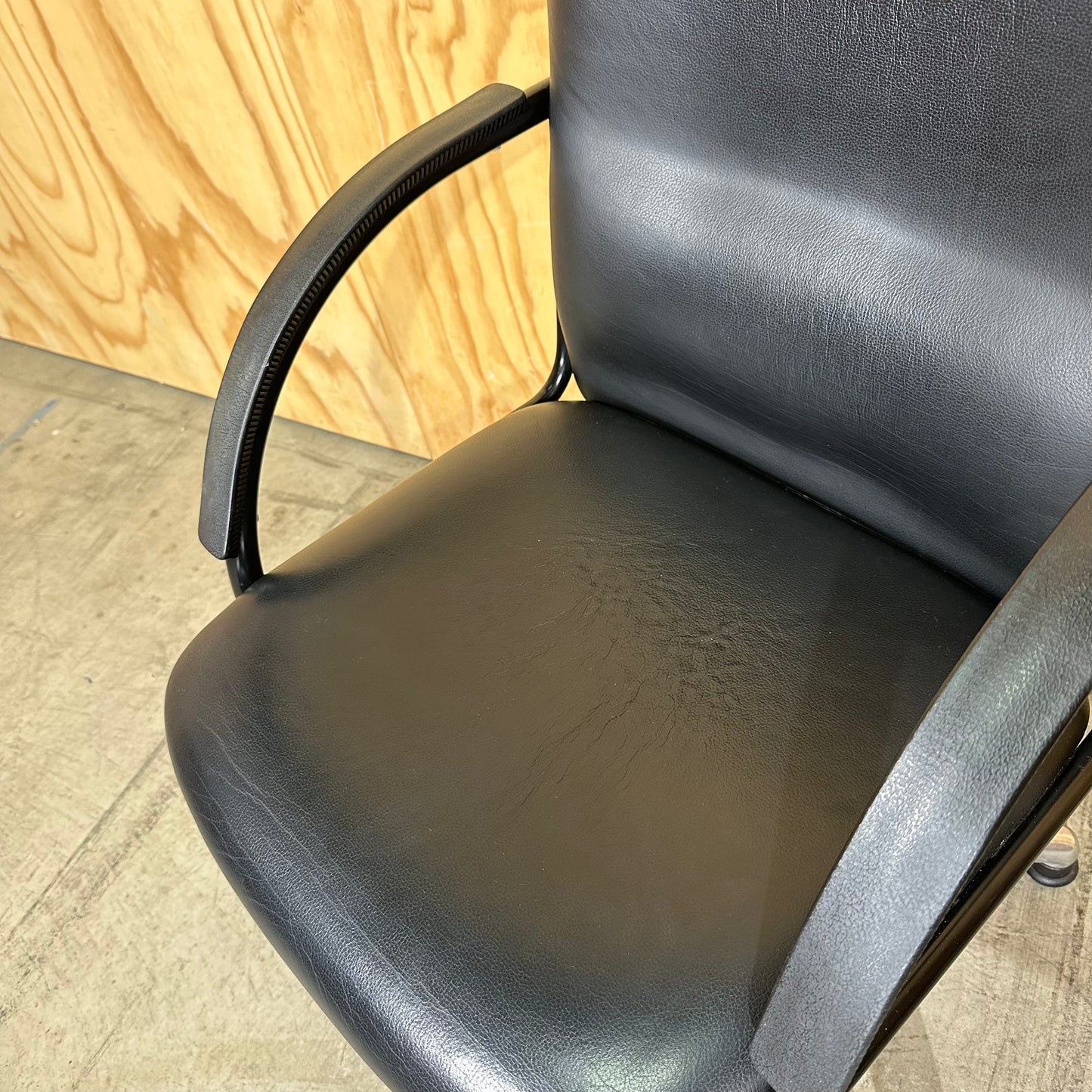 Black faux leather swivel chair on chrome base by Pago