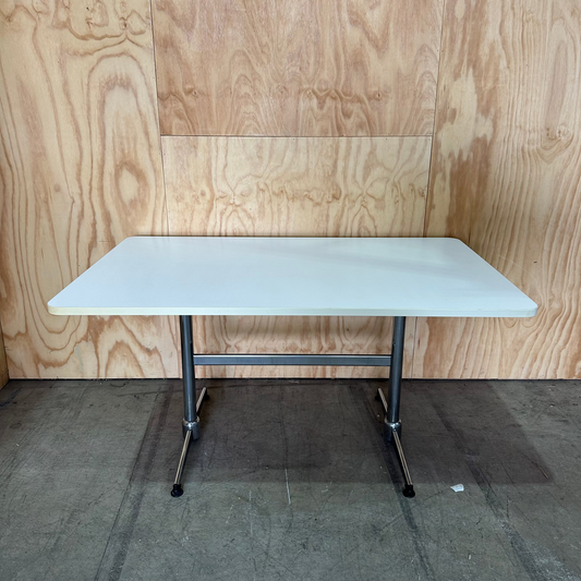White table on chrome leg base