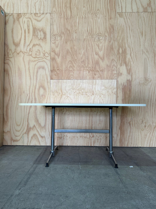 White table on chrome leg base