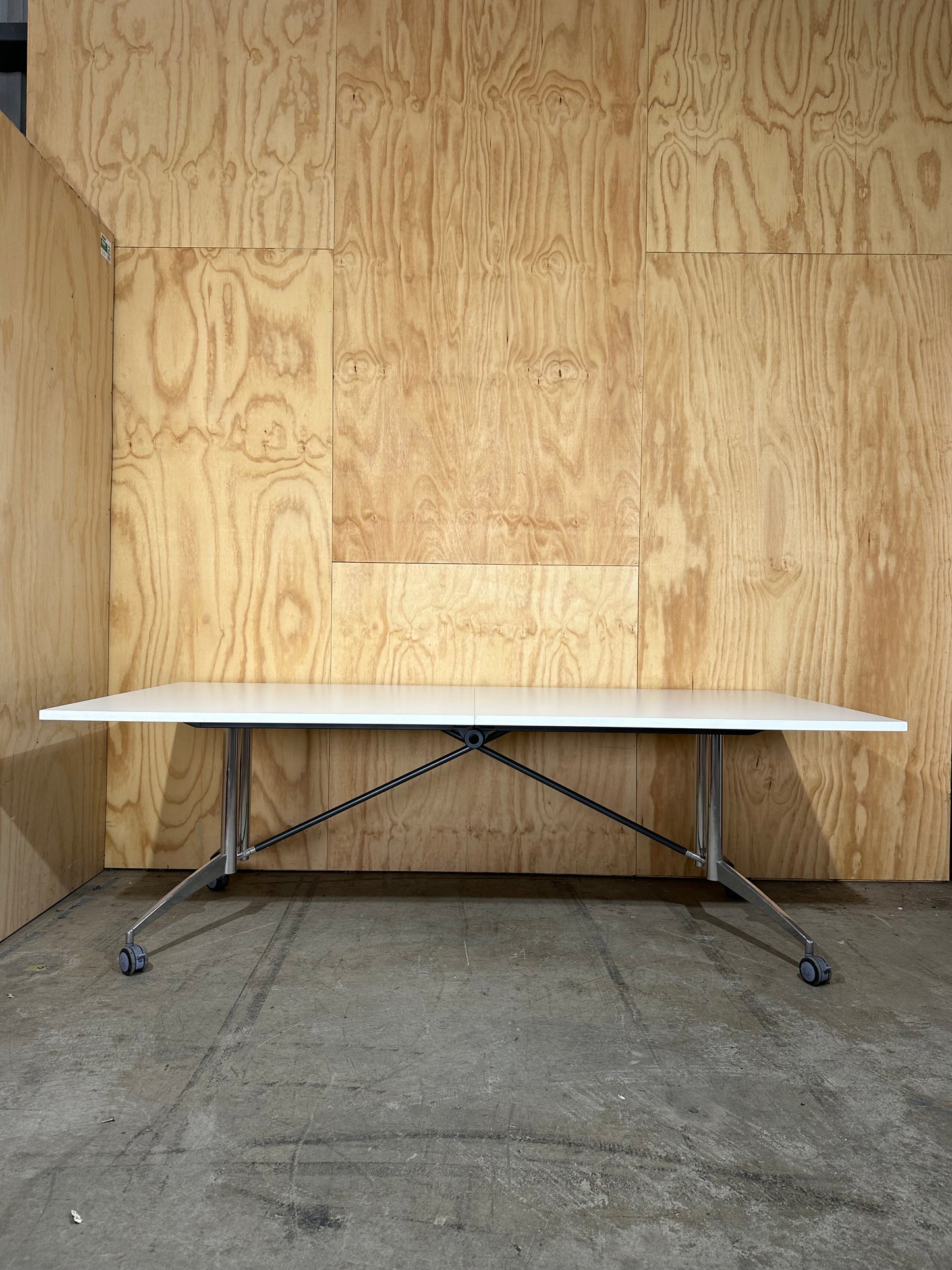 White folding table on castors
