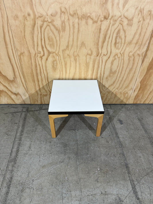 Square white top coffee table on brown legs