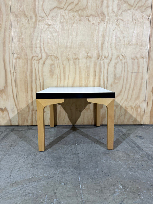 Square white top coffee table on brown legs