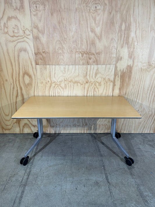 Wilkhahn table with light wood veneer on castors
