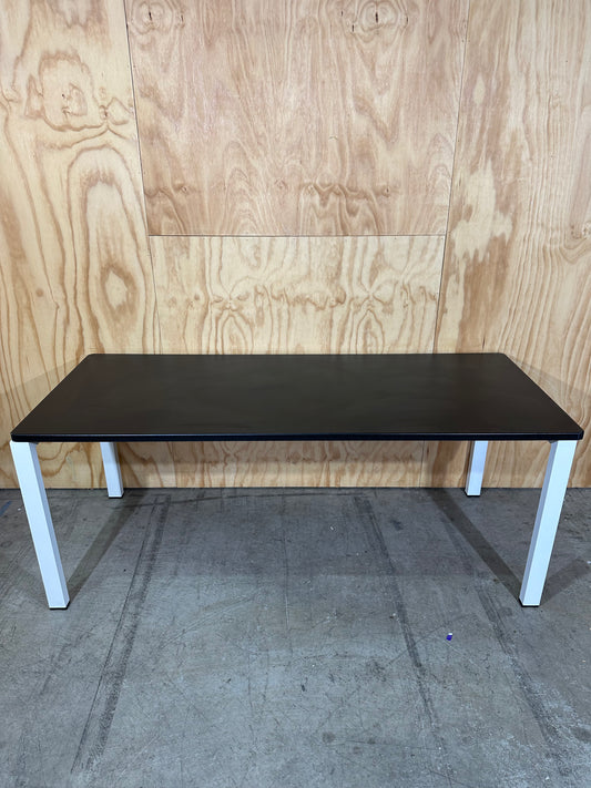 Long black desk on white frame