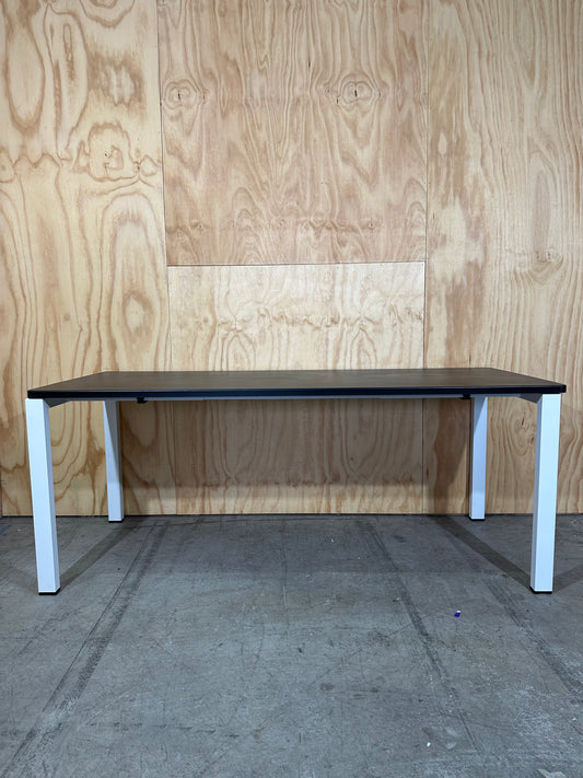 Long black desk on white frame