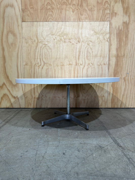 White coffee table on chrome base