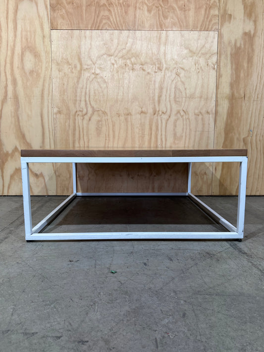 Square coffee table on white metal frame