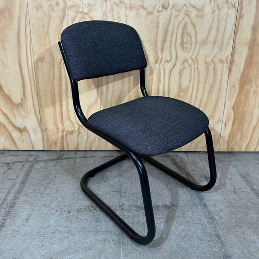 Upholstered grey cantilever chair