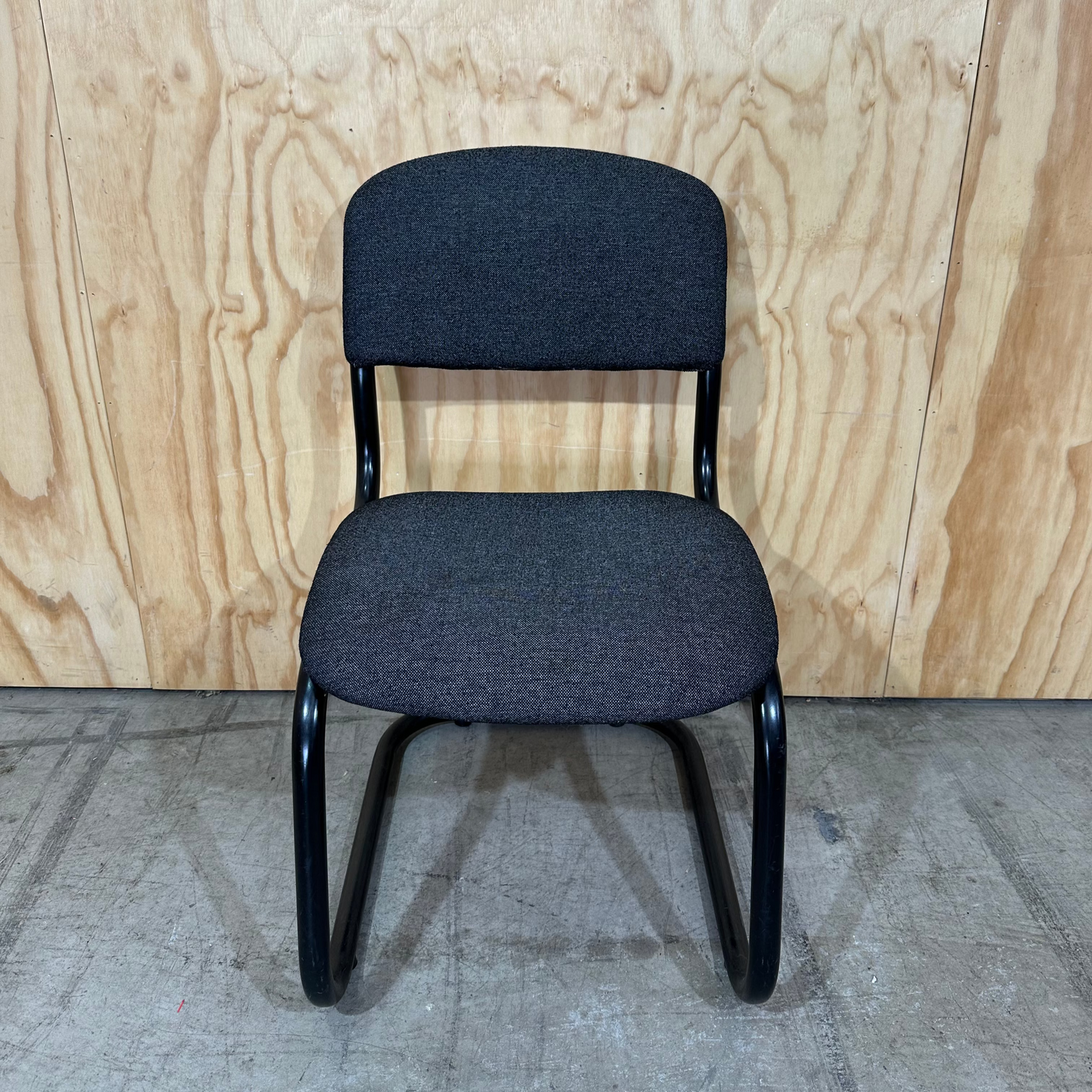 Upholstered grey cantilever chair