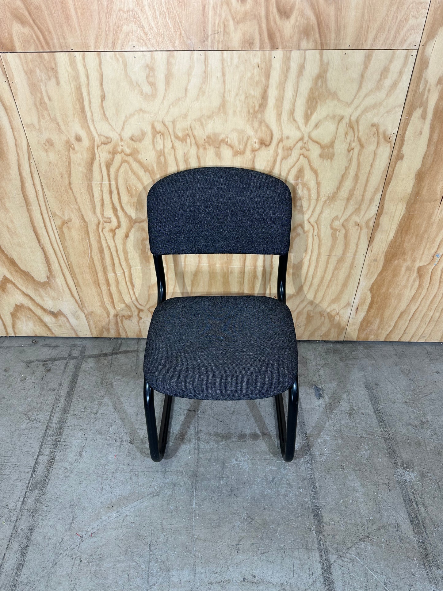Upholstered grey cantilever chair