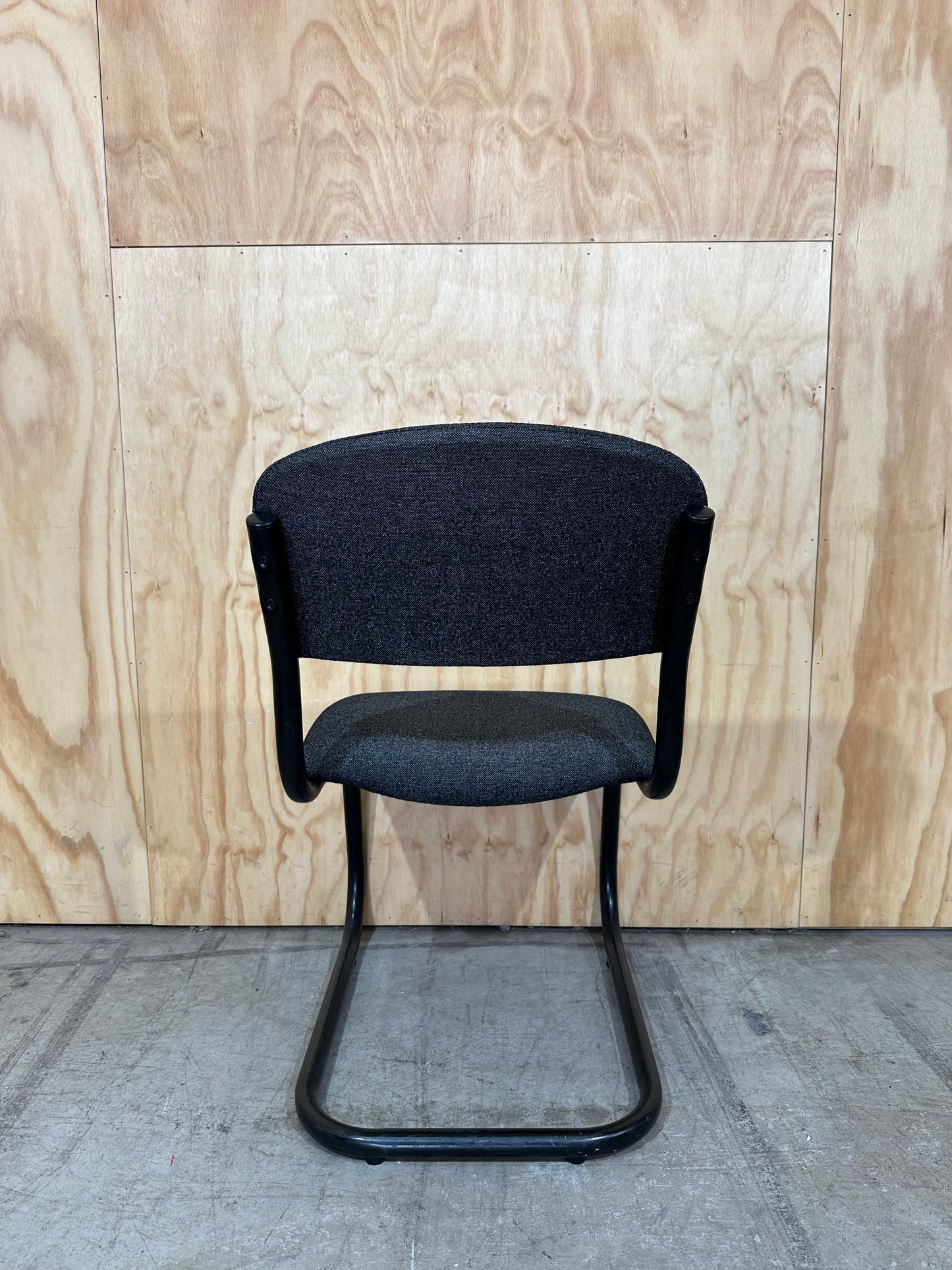 Upholstered grey cantilever chair