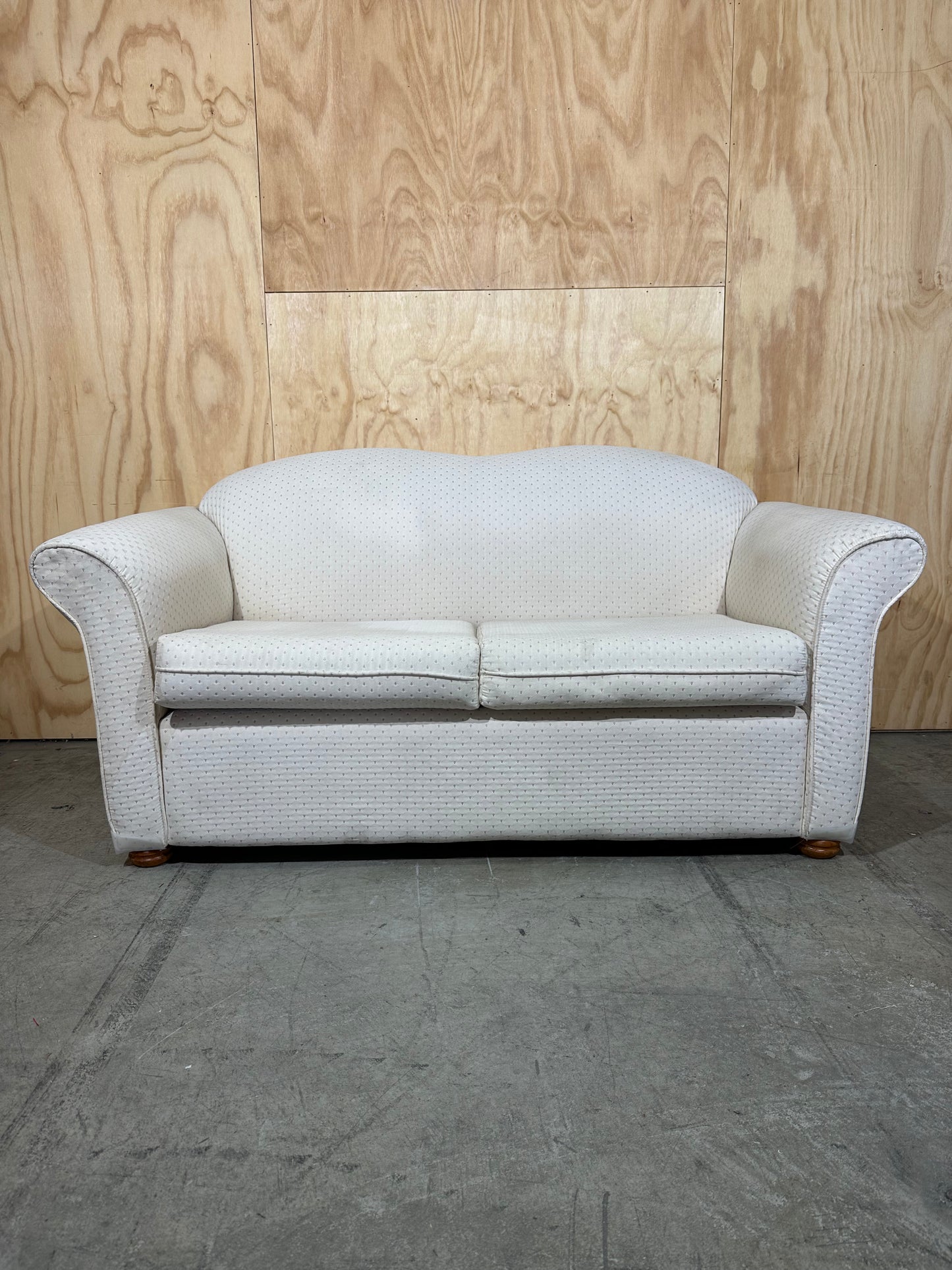 White couch with pattern