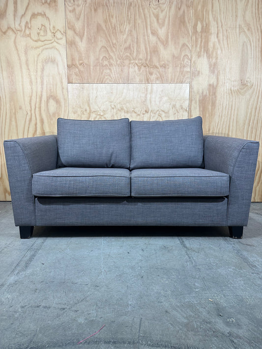 Grey 2 seater couch by Ridge Furniture