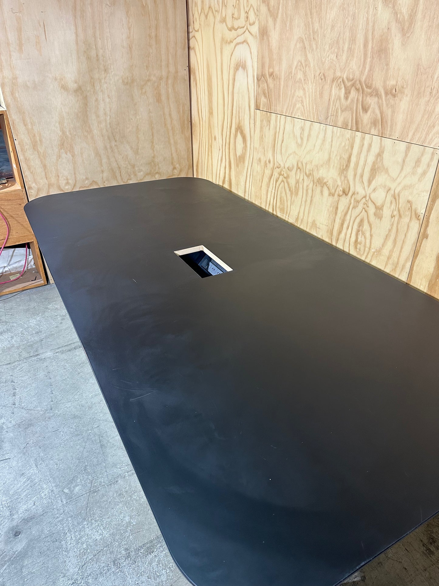 Black Boardroom table with built in powerboard