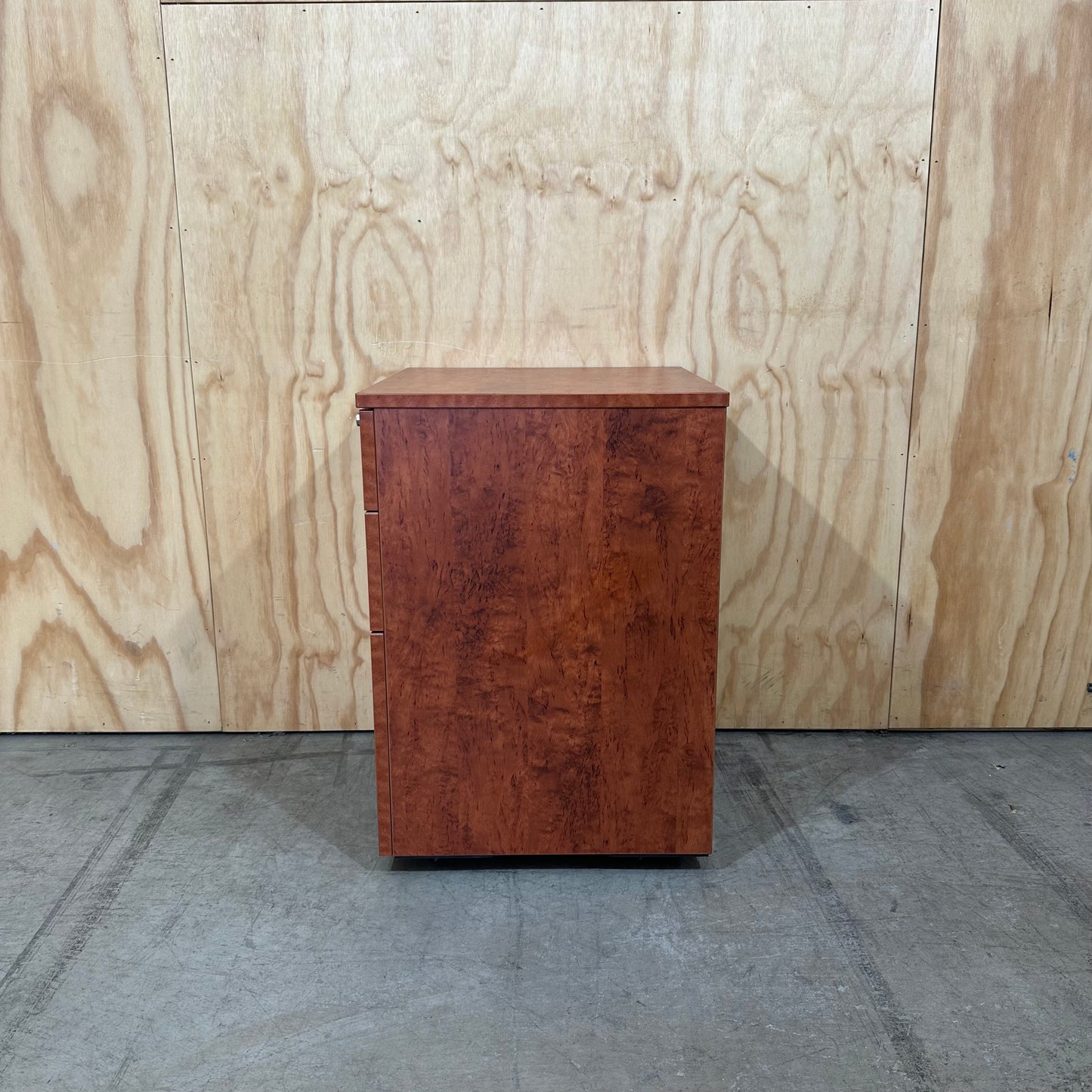 Wood veneer three drawer pedestal