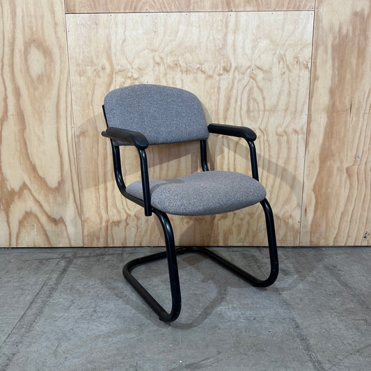 Light grey cantilever visitor chair with black frame