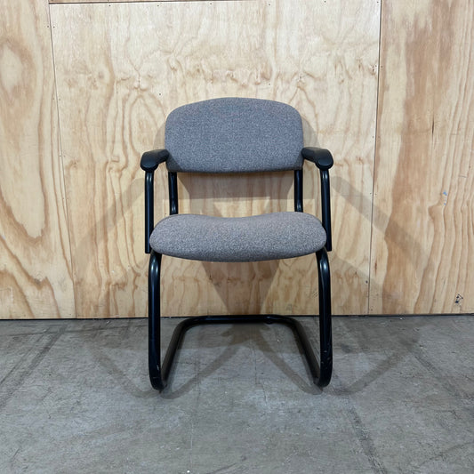 Light grey cantilever visitor chair with black frame