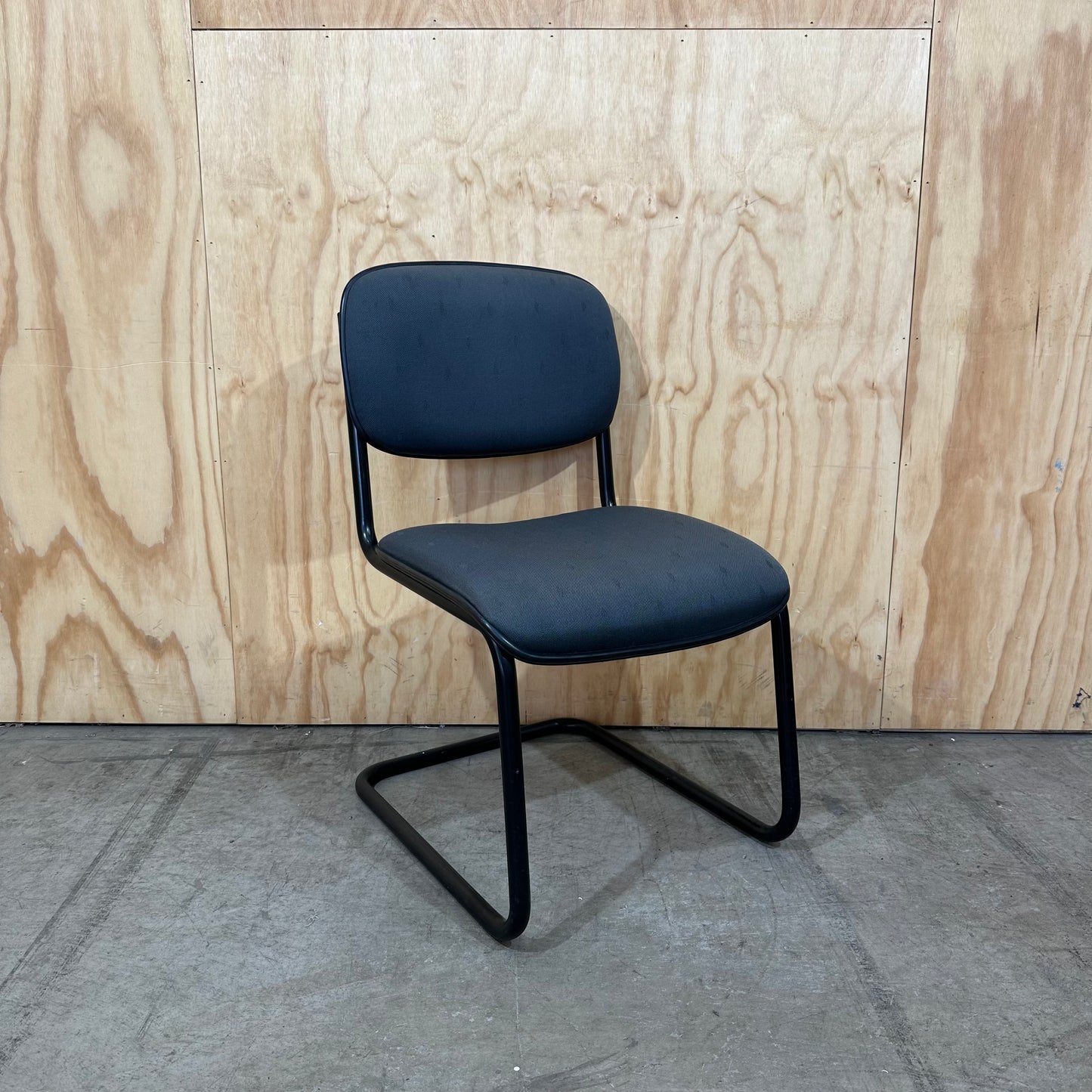 Navy upholstered sled base visitor chair