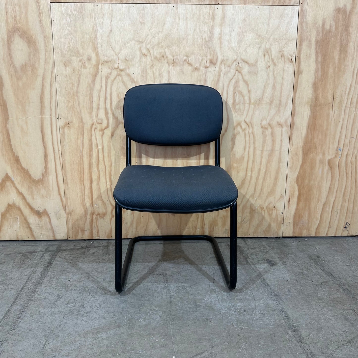 Navy upholstered sled base visitor chair
