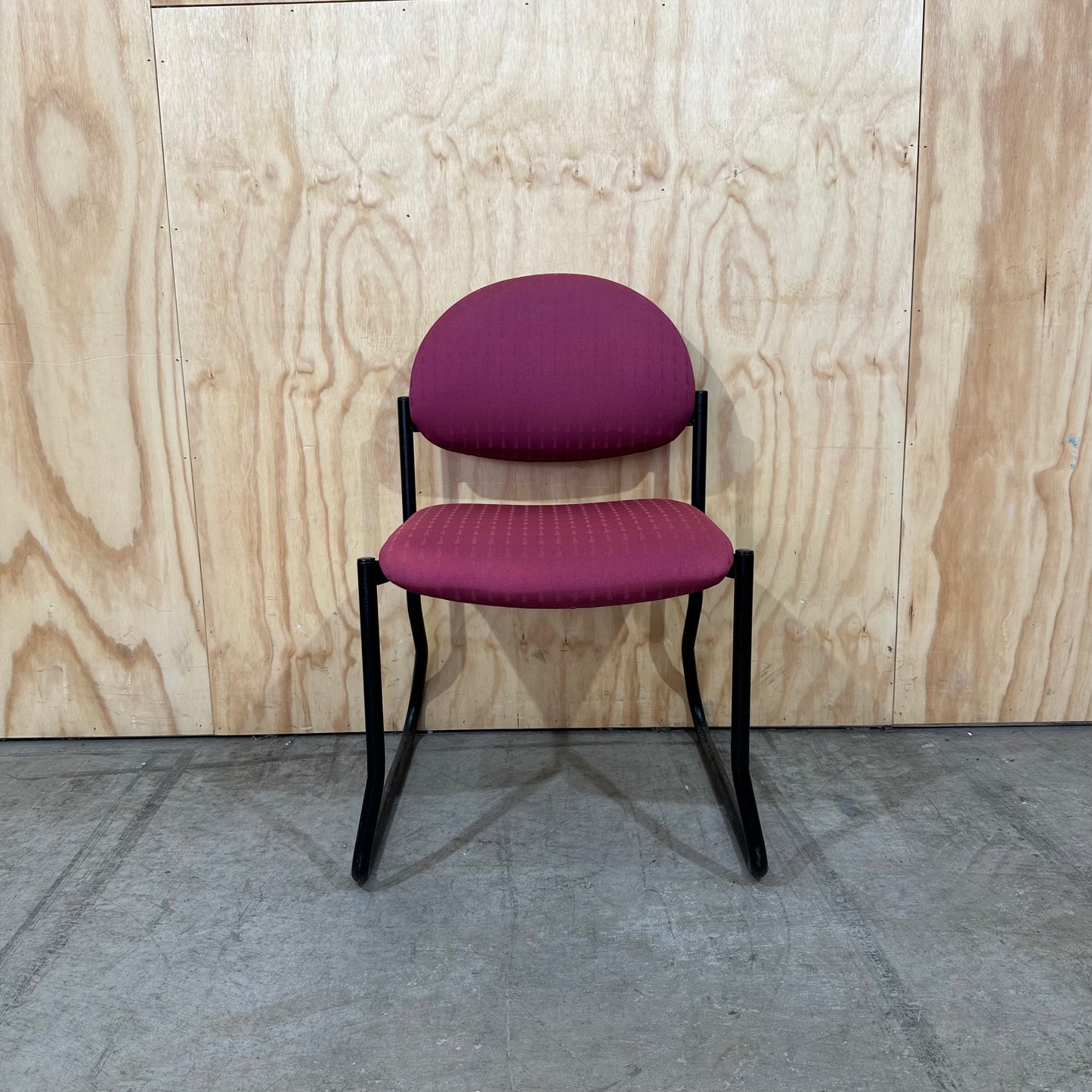 Red upholstered sled chair