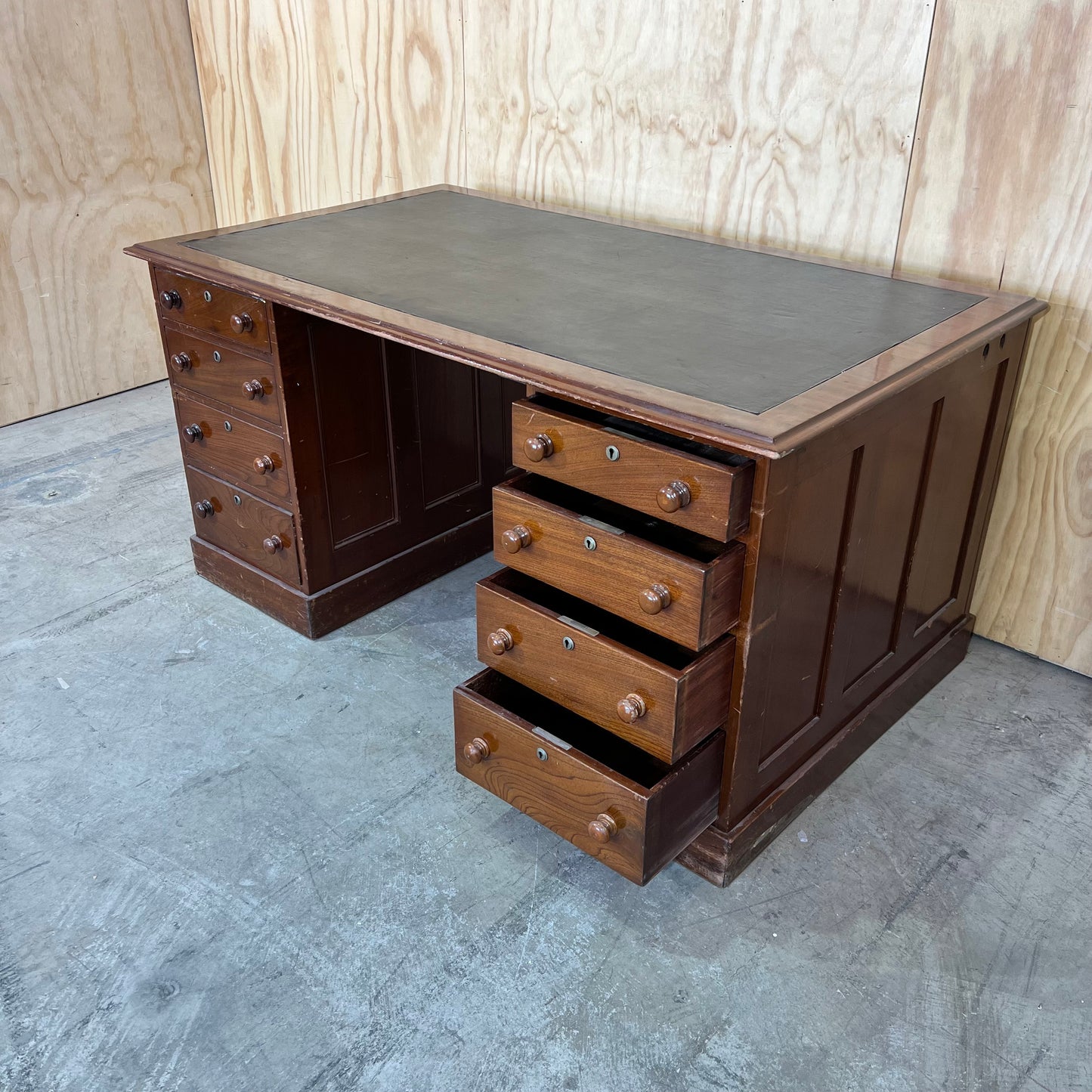Antique timber executive desk with black leather top