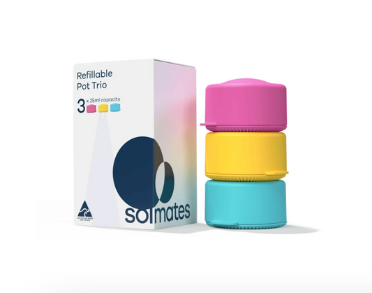 A Solmates refillable pot trio set, featuring a white box with pink and blue gradient accents alongside three stacked, colorful silicone pots in pink, yellow, and blue on a white background.