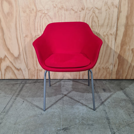 Red tub chair on grey metal legs