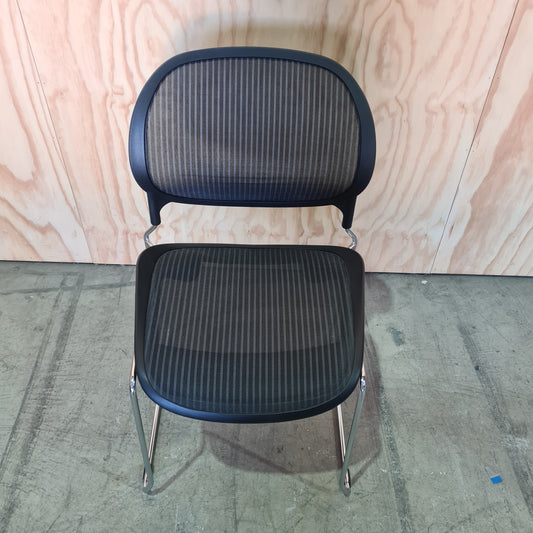Black stacking chair with mesh back