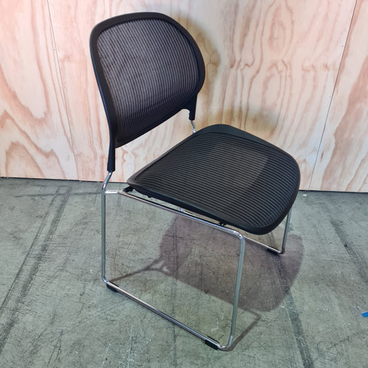 Black stacking chair with mesh back
