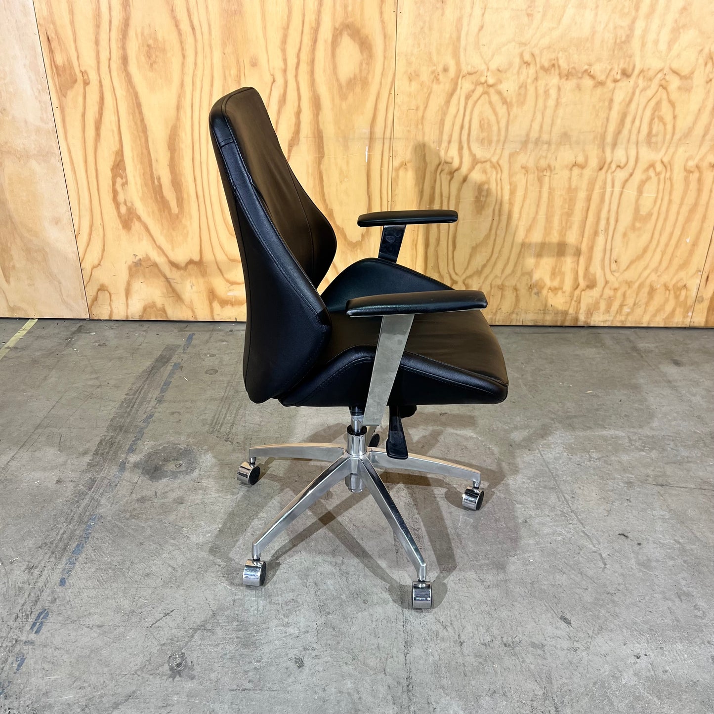 Black leather executive chair with arms