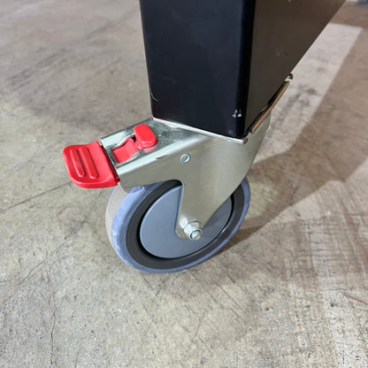 Timber table on black metal frame with castors